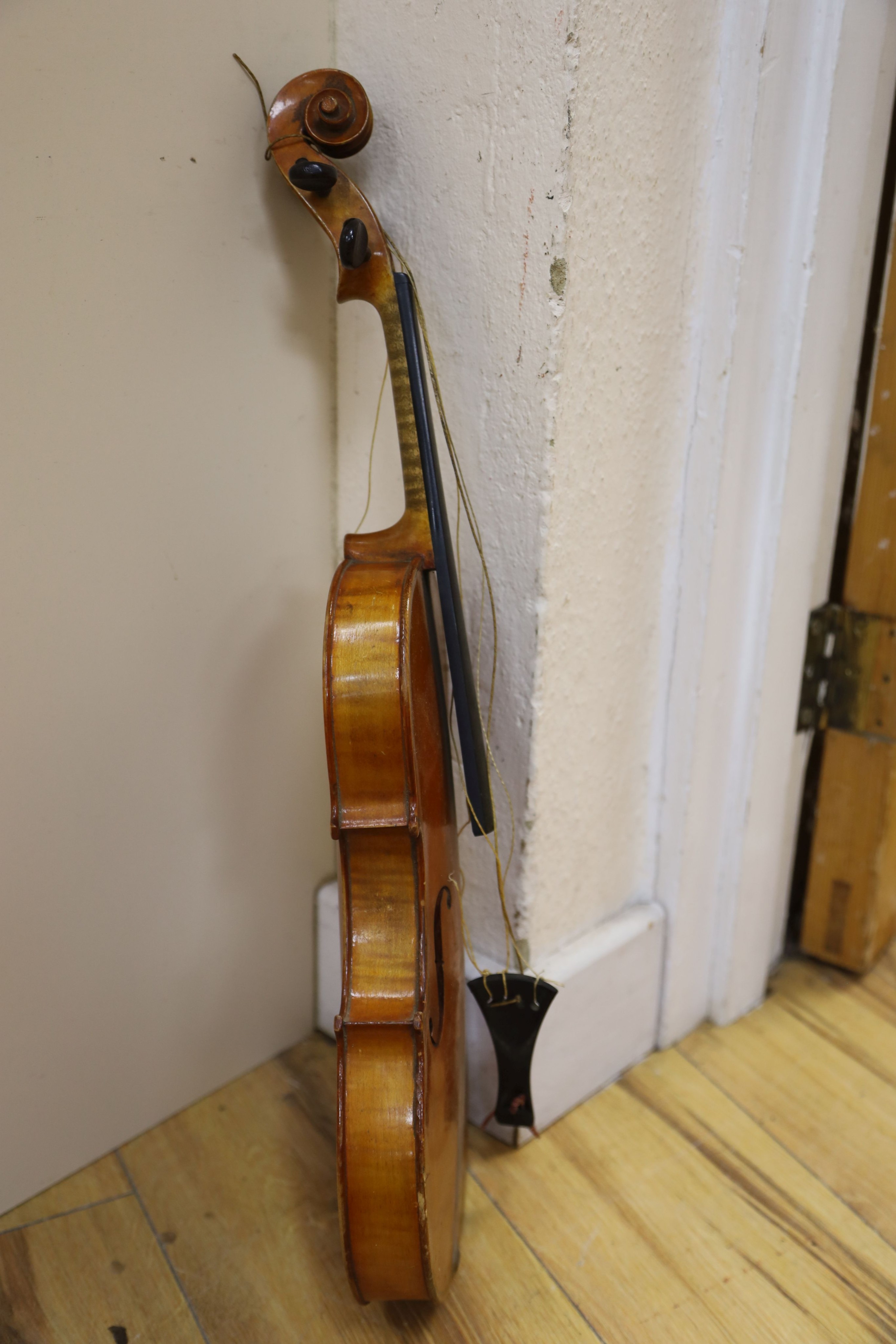 A Stradivarius copy violin and two bows and another bow, both cased, backs 33cm and 30cm